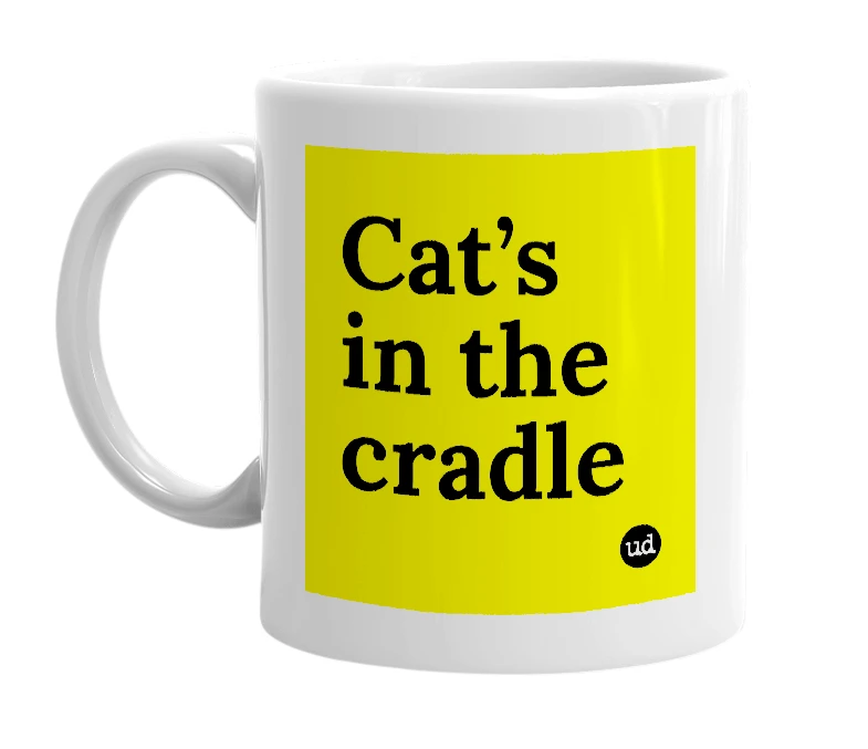 White mug with 'Cat’s in the cradle' in bold black letters