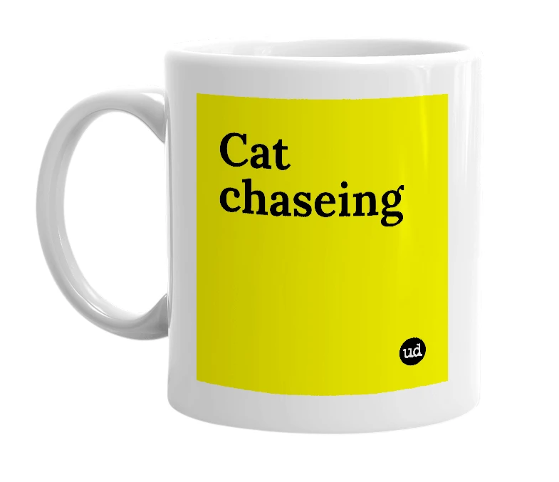 White mug with 'Cat chaseing' in bold black letters