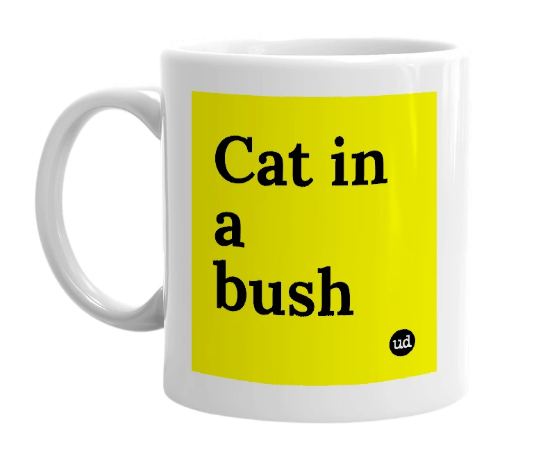 White mug with 'Cat in a bush' in bold black letters