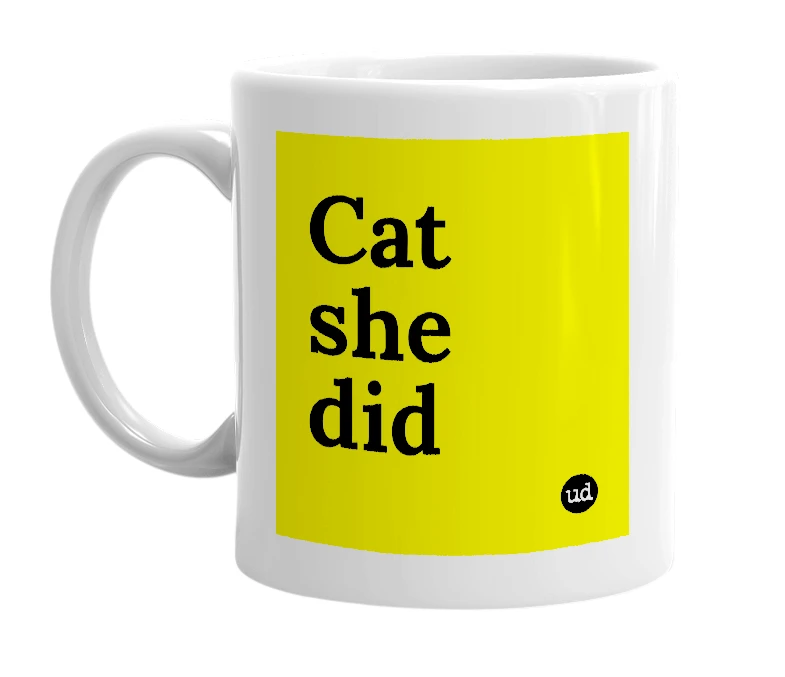 White mug with 'Cat she did' in bold black letters
