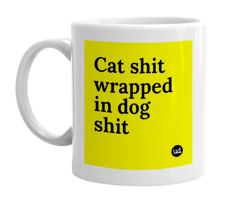 White mug with 'Cat shit wrapped in dog shit' in bold black letters
