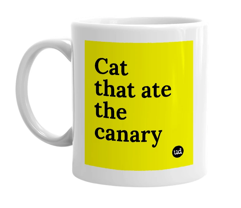 White mug with 'Cat that ate the canary' in bold black letters