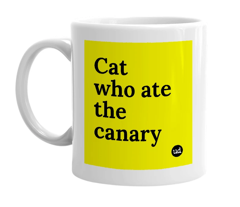 White mug with 'Cat who ate the canary' in bold black letters