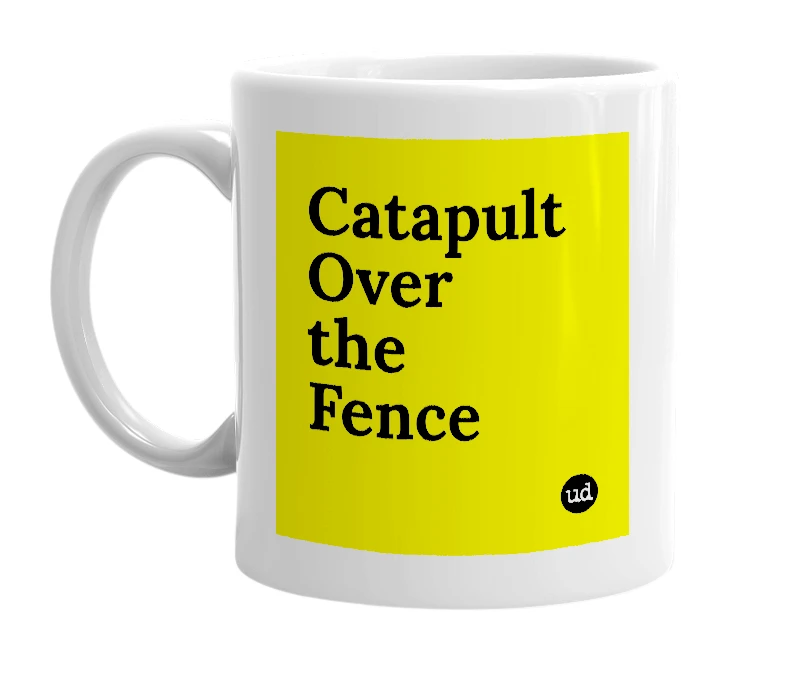 White mug with 'Catapult Over the Fence' in bold black letters
