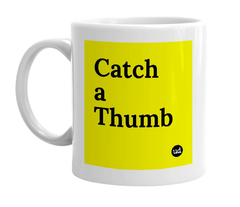 White mug with 'Catch a Thumb' in bold black letters