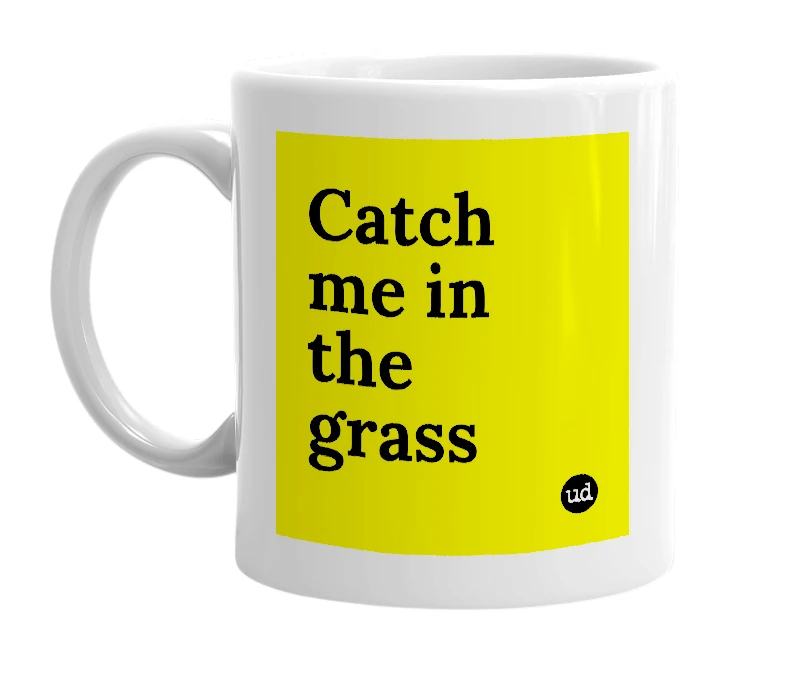 White mug with 'Catch me in the grass' in bold black letters