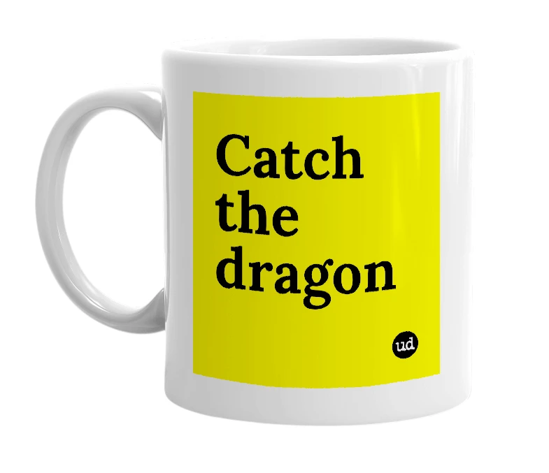 White mug with 'Catch the dragon' in bold black letters