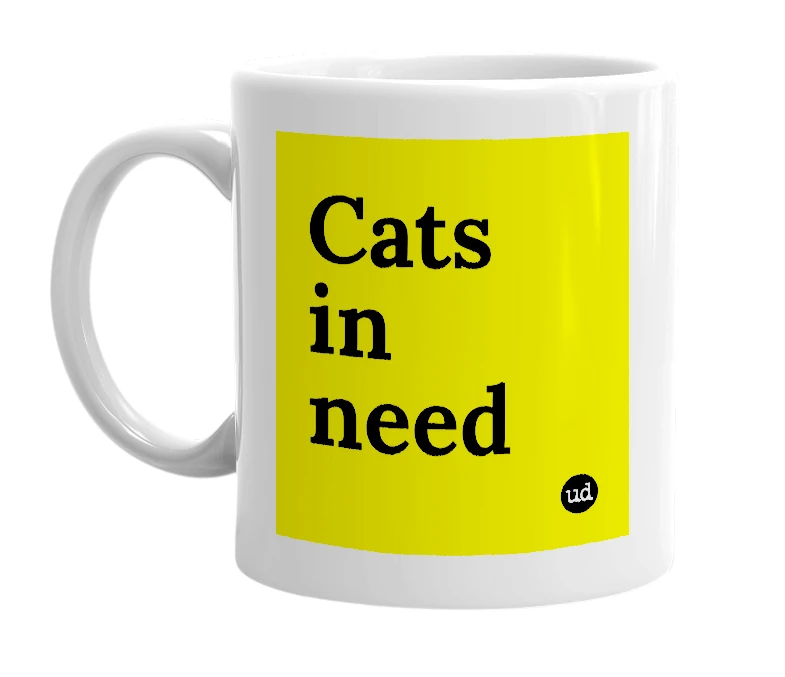 White mug with 'Cats in need' in bold black letters