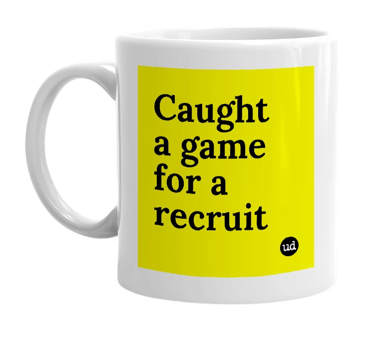 White mug with 'Caught a game for a recruit' in bold black letters