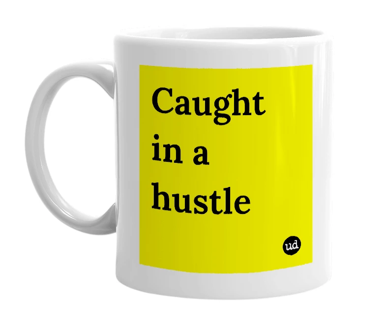 White mug with 'Caught in a hustle' in bold black letters