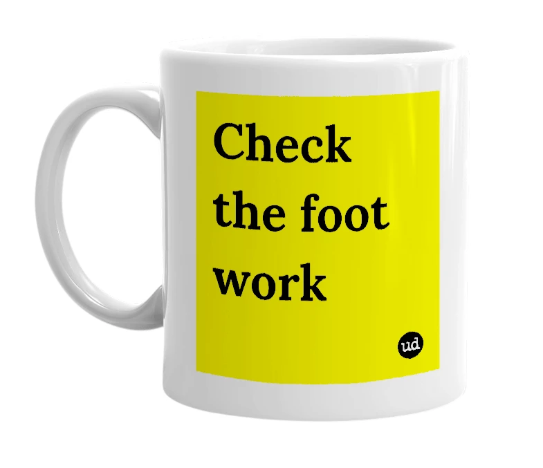 White mug with 'Check the foot work' in bold black letters