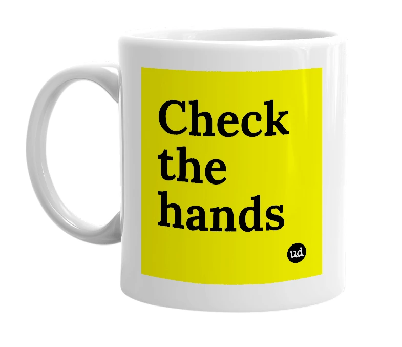 White mug with 'Check the hands' in bold black letters