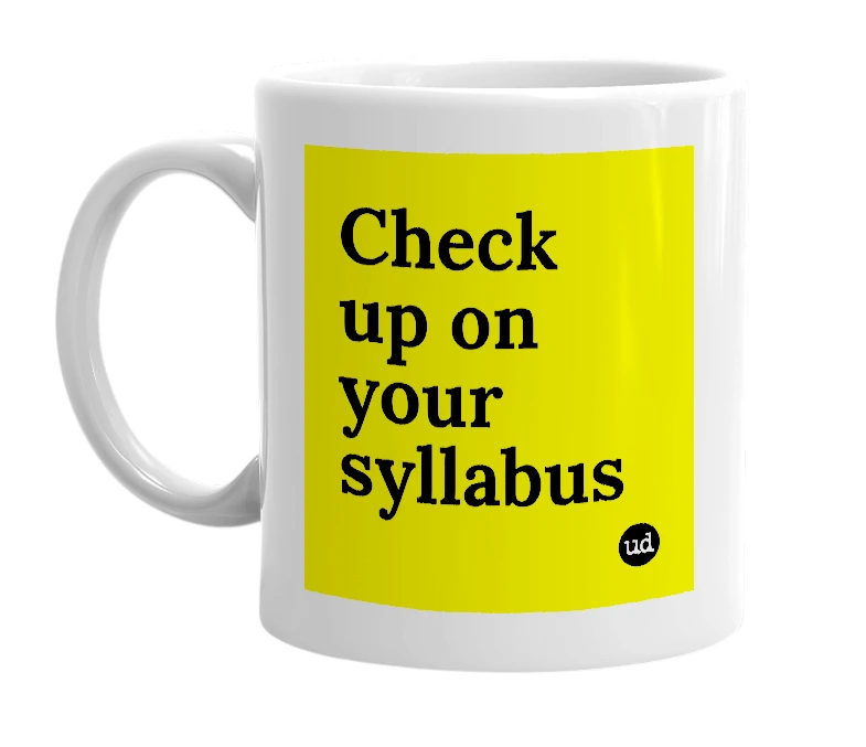 White mug with 'Check up on your syllabus' in bold black letters