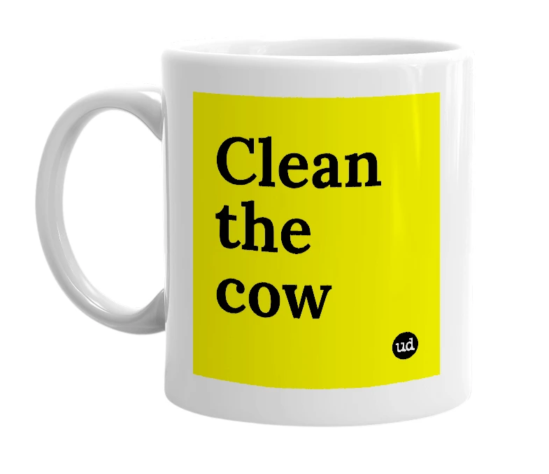 White mug with 'Clean the cow' in bold black letters