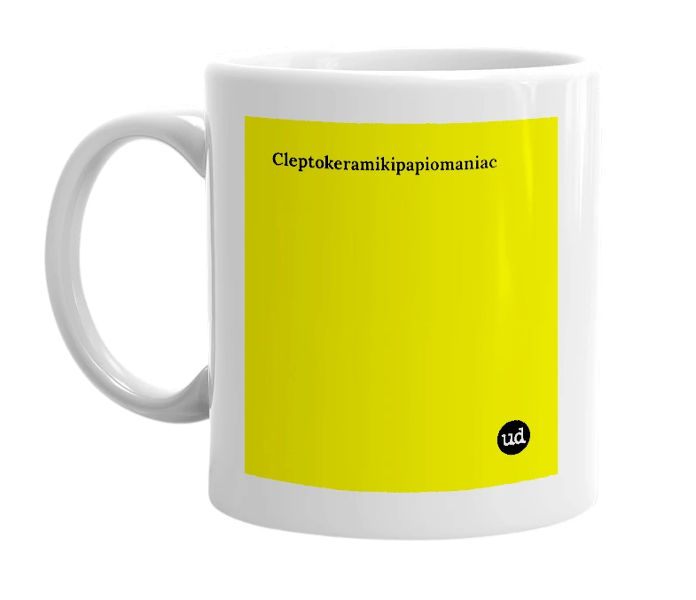 White mug with 'Cleptokeramikipapiomaniac' in bold black letters