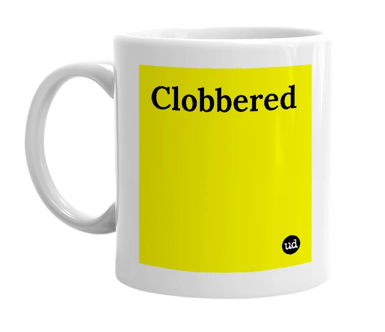 White mug with 'Clobbered' in bold black letters
