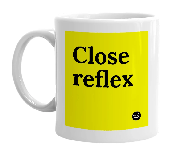 White mug with 'Close reflex' in bold black letters