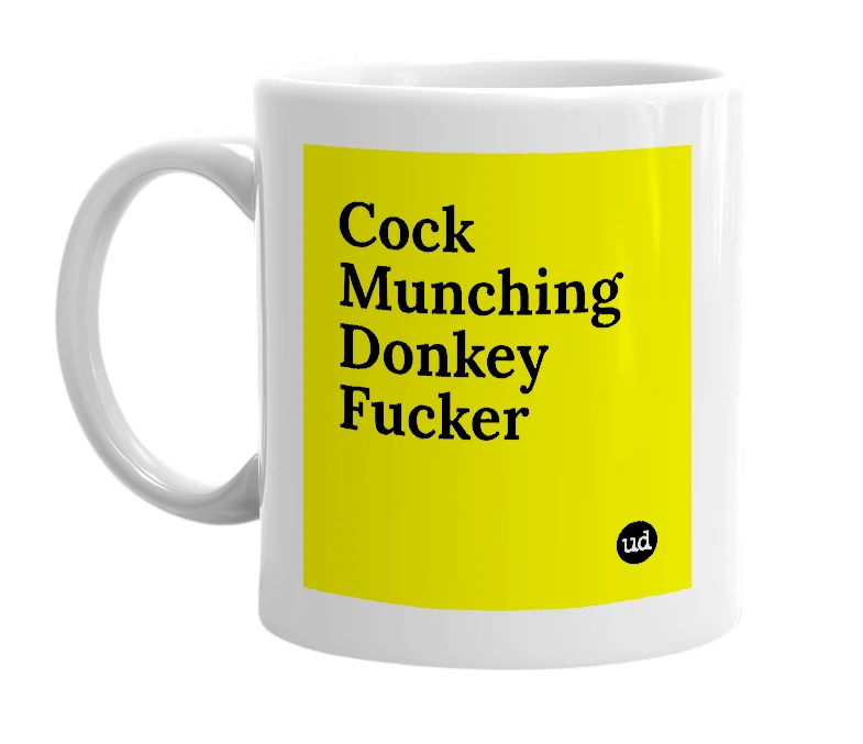 White mug with 'Cock Munching Donkey Fucker' in bold black letters