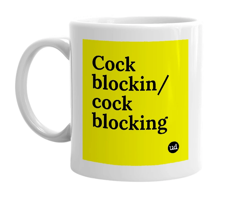 White mug with 'Cock blockin/ cock blocking' in bold black letters