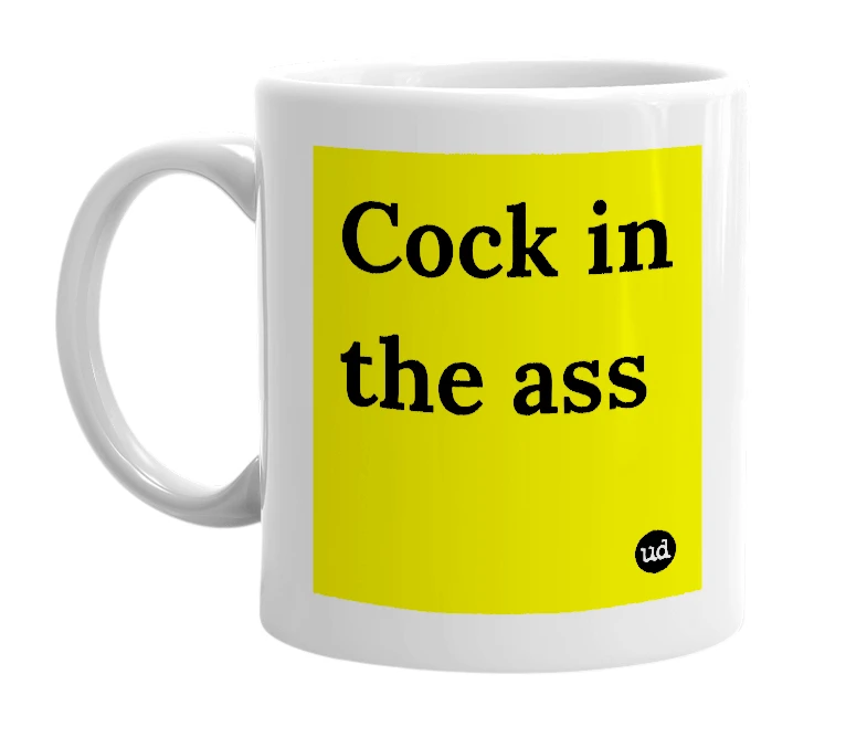 White mug with 'Cock in the ass' in bold black letters