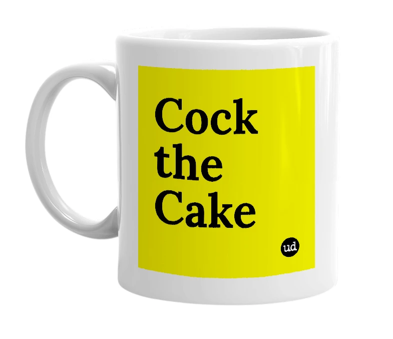 White mug with 'Cock the Cake' in bold black letters