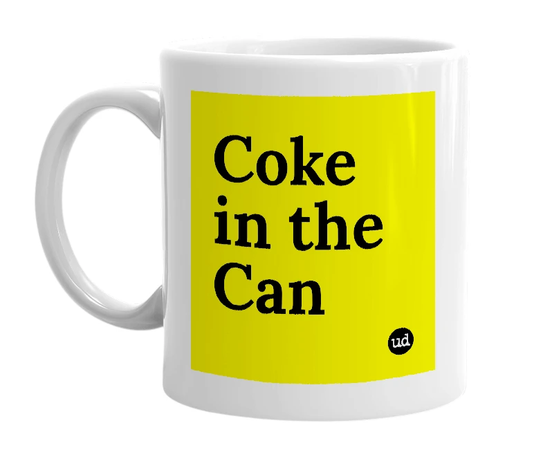 White mug with 'Coke in the Can' in bold black letters