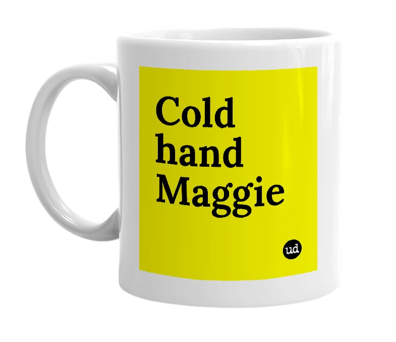 White mug with 'Cold hand Maggie' in bold black letters