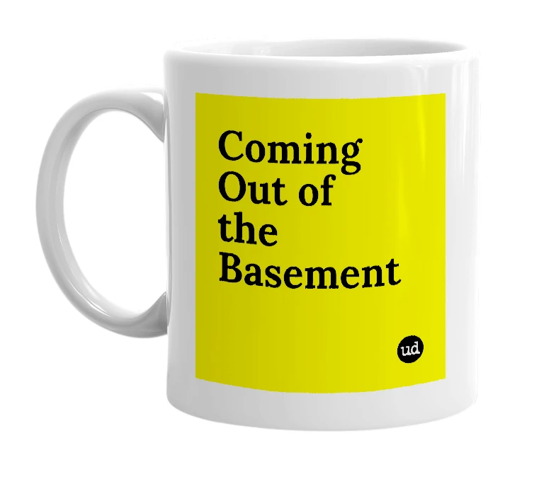 White mug with 'Coming Out of the Basement' in bold black letters