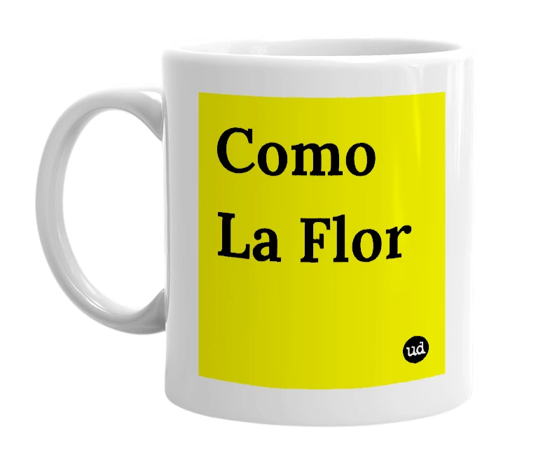 White mug with 'Como La Flor' in bold black letters