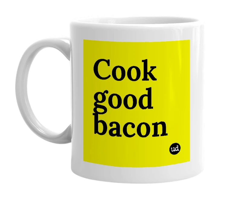 White mug with 'Cook good bacon' in bold black letters