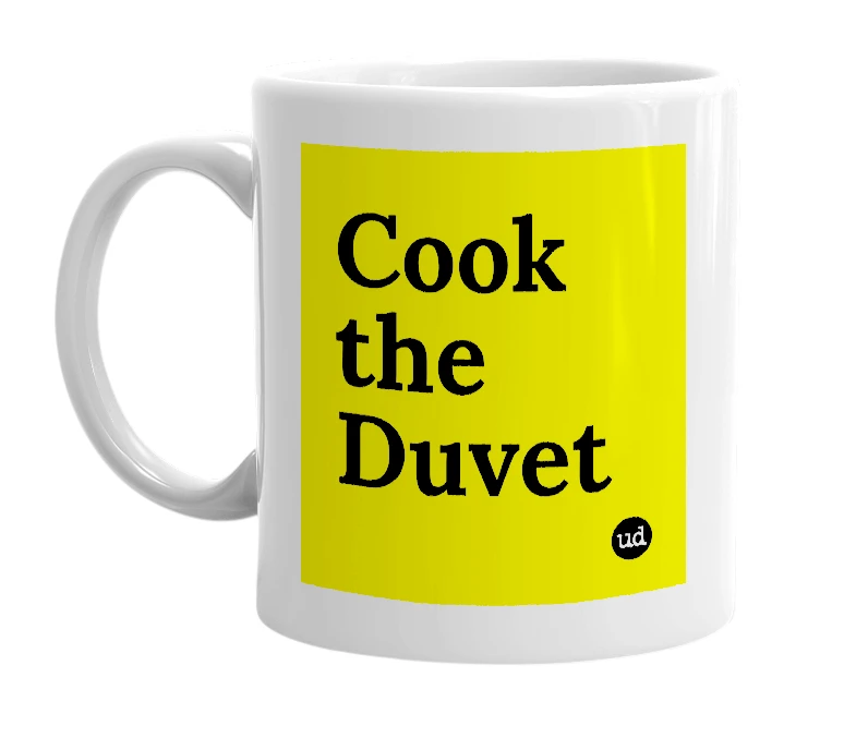 White mug with 'Cook the Duvet' in bold black letters