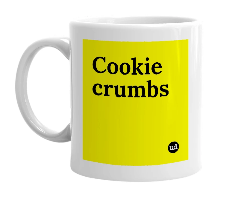 White mug with 'Cookie crumbs' in bold black letters