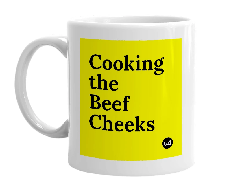 White mug with 'Cooking the Beef Cheeks' in bold black letters