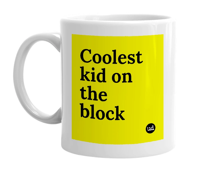 White mug with 'Coolest kid on the block' in bold black letters