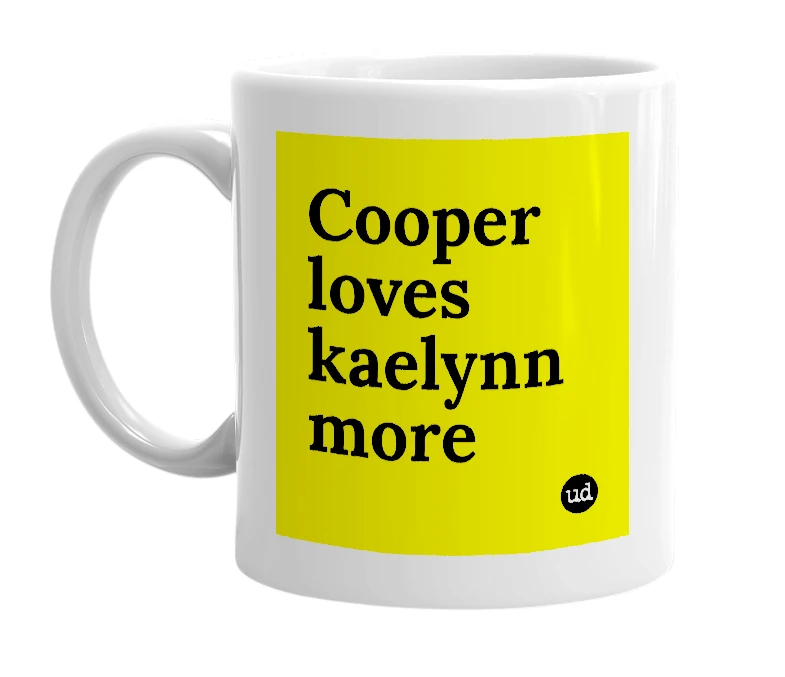 White mug with 'Cooper loves kaelynn more' in bold black letters