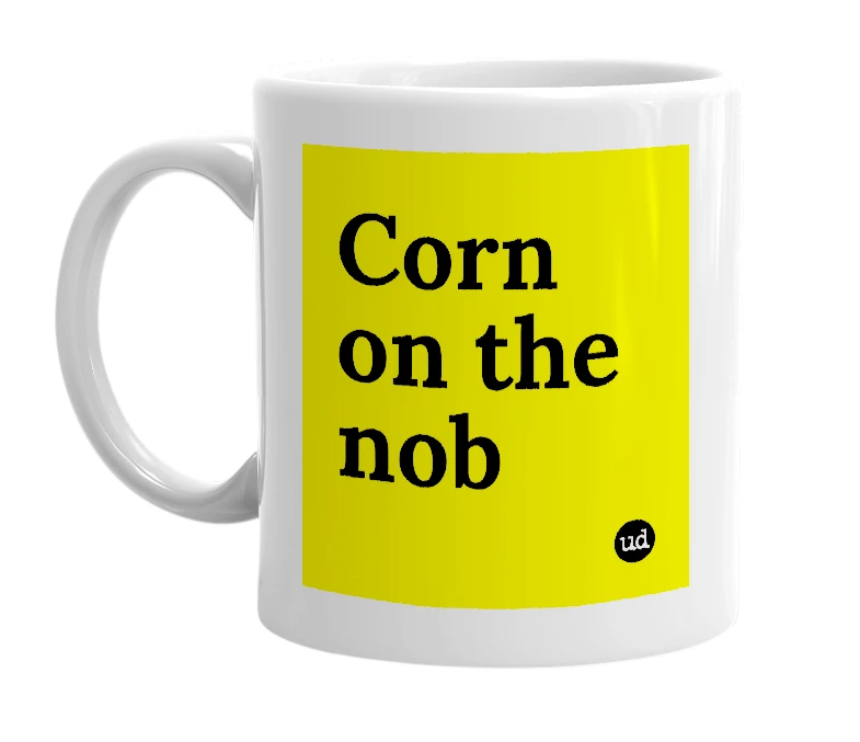 White mug with 'Corn on the nob' in bold black letters