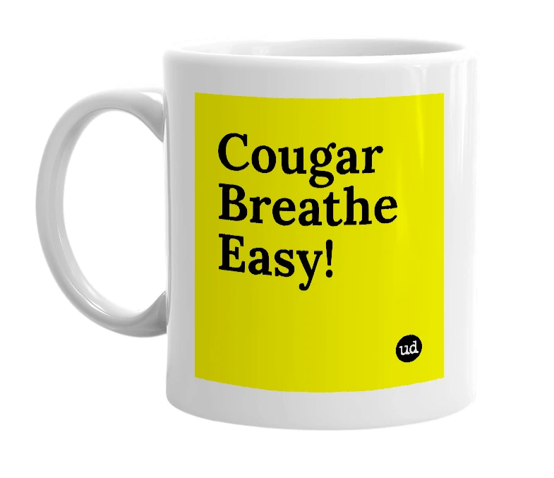 White mug with 'Cougar Breathe Easy!' in bold black letters