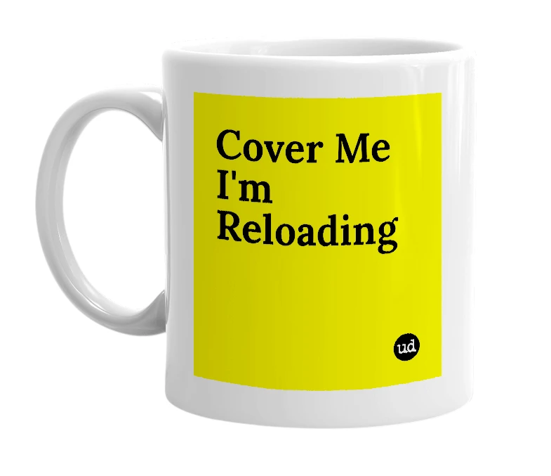 White mug with 'Cover Me I'm Reloading' in bold black letters