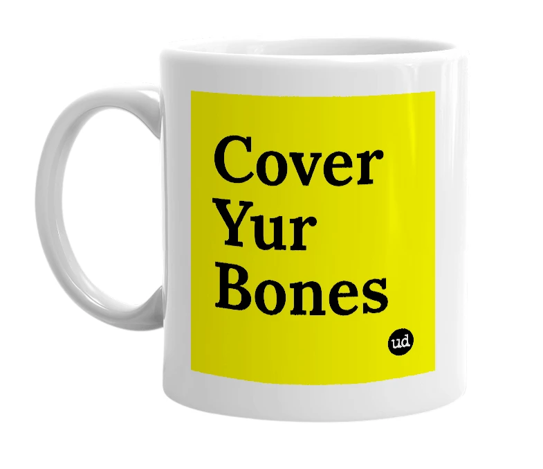 White mug with 'Cover Yur Bones' in bold black letters