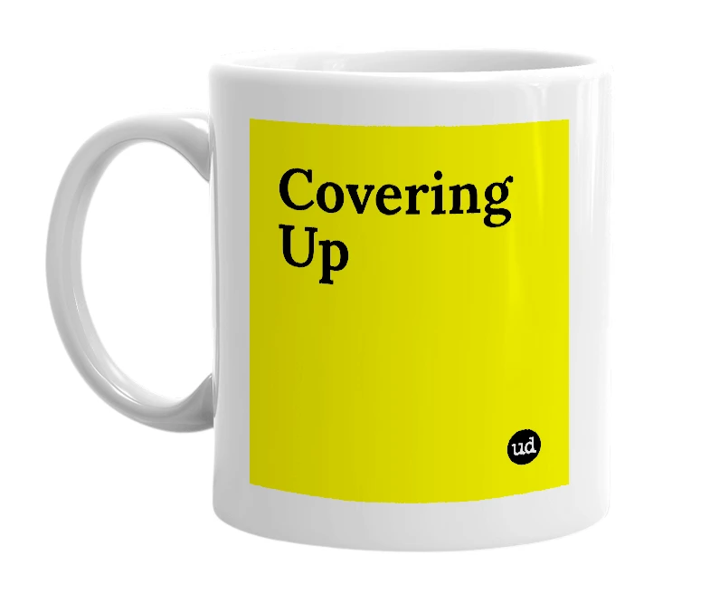 White mug with 'Covering Up' in bold black letters