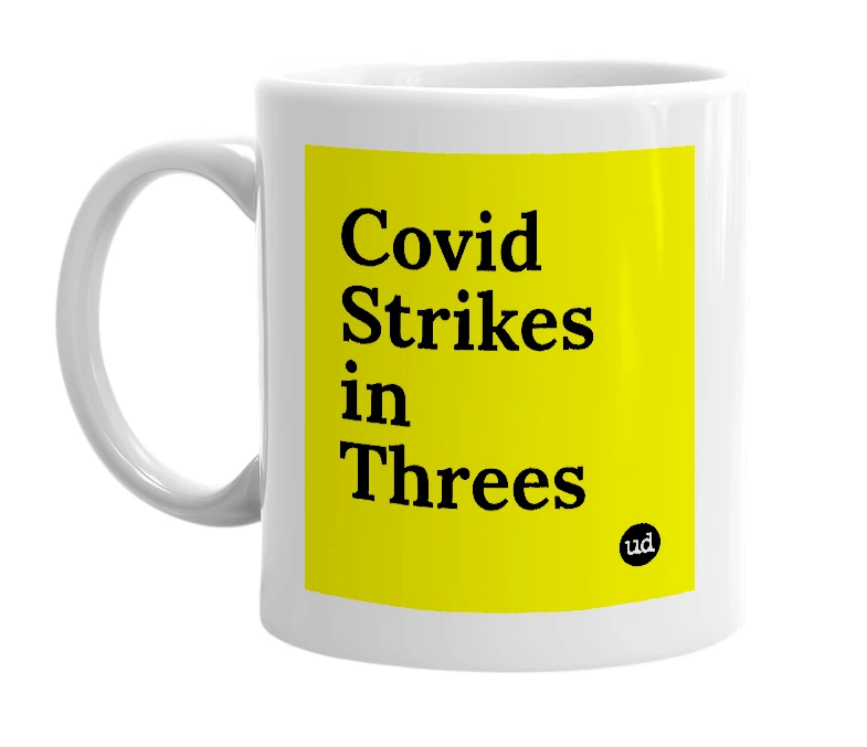 White mug with 'Covid Strikes in Threes' in bold black letters