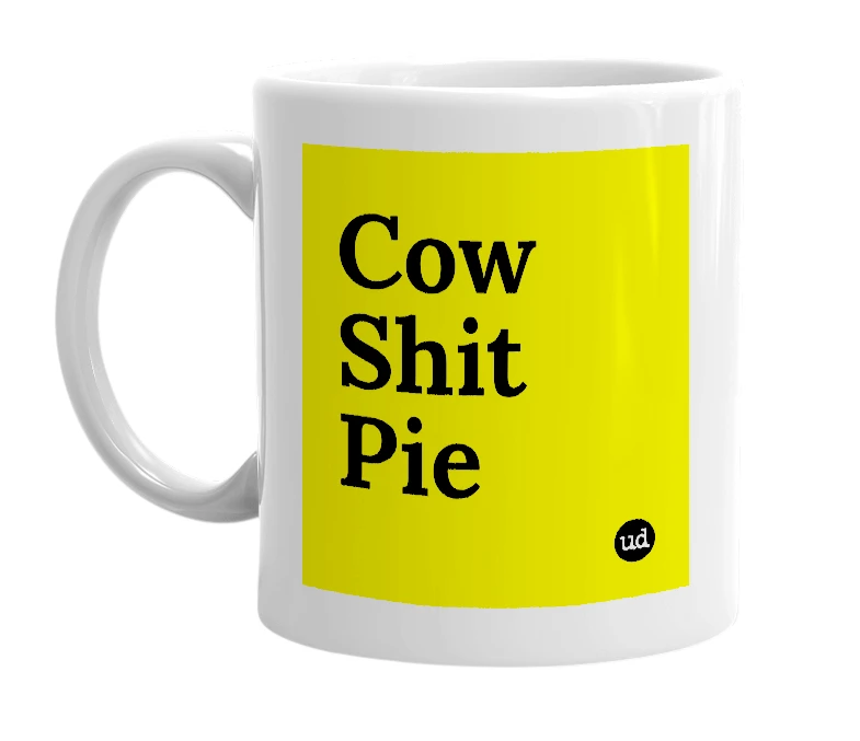 White mug with 'Cow Shit Pie' in bold black letters