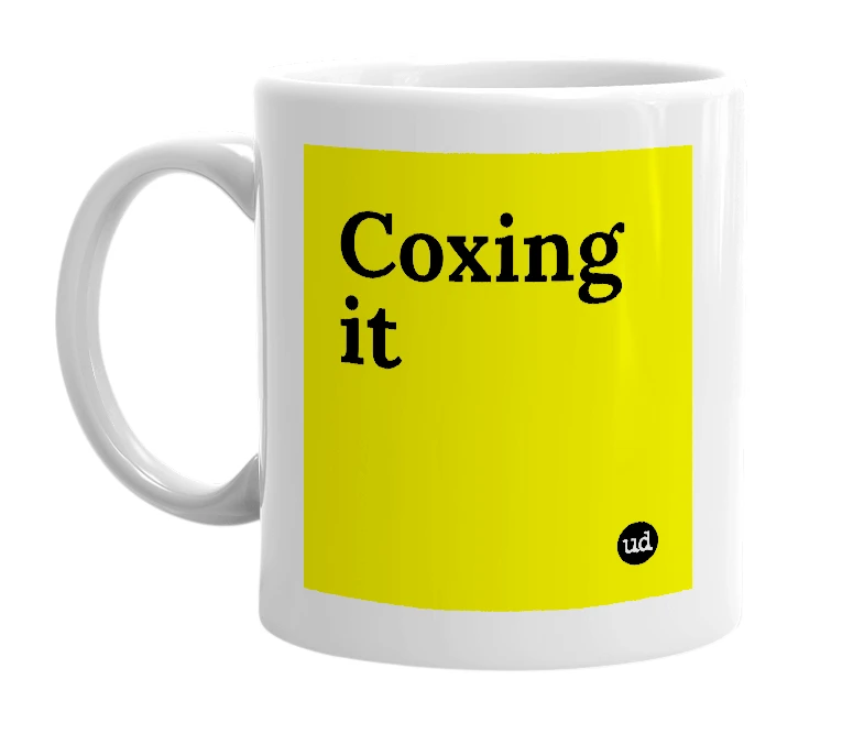 White mug with 'Coxing it' in bold black letters