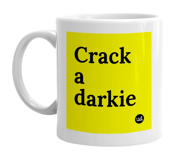 White mug with 'Crack a darkie' in bold black letters