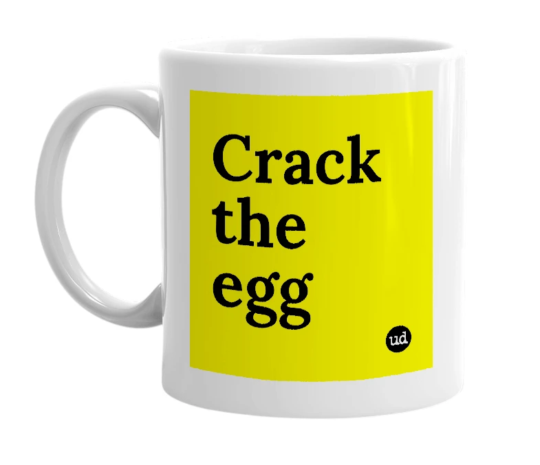 White mug with 'Crack the egg' in bold black letters