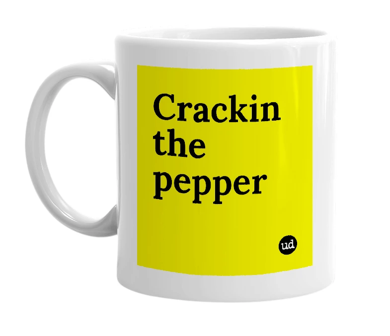 White mug with 'Crackin the pepper' in bold black letters