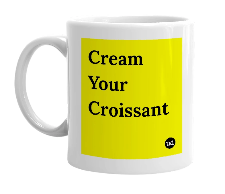White mug with 'Cream Your Croissant' in bold black letters