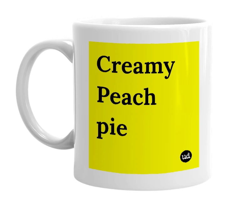 White mug with 'Creamy Peach pie' in bold black letters