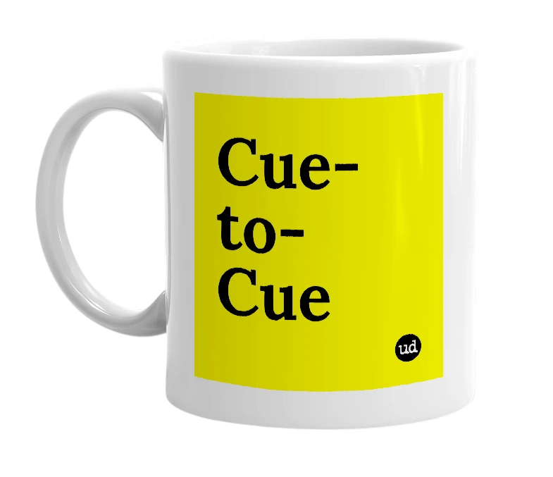 White mug with 'Cue-to-Cue' in bold black letters