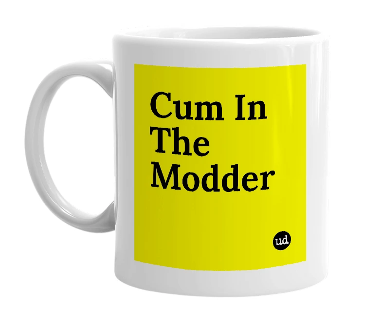 White mug with 'Cum In The Modder' in bold black letters